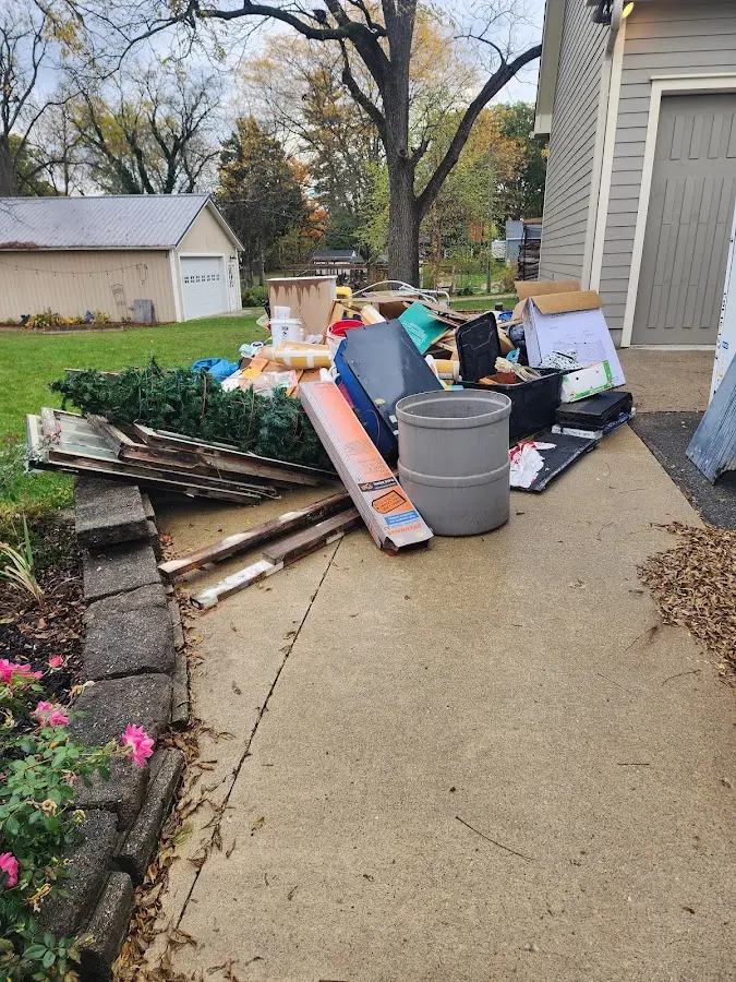 Dumpster being loaded with debris for Residential Dumpster Rental in Hideaway